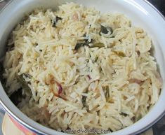 a white bowl filled with rice and vegetables