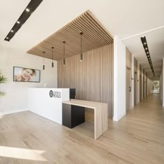 an office with wood paneling and white walls