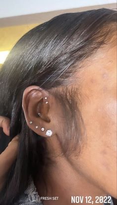 a woman with ear piercings on her ears