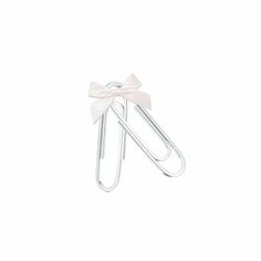 a white paper clip with a bow on it