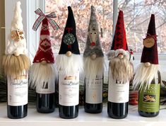 several bottles of wine with gnome heads on them