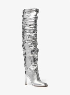 Take your look to new heights with our statement-making Kelsea boot. Crafted from crackled metallic leather, this thigh-high style juxtaposes a super-slouchy design with a sleek square toe and curved heel. Show them off alongside a mini skirt or dress. Chic Metallic Heeled Boots For Fall, Glamorous Leather Knee-high Boots For Night Out, Glamorous Metallic Knee-high Boots, Silver Leather Knee-high Boots, Metallic Leather Boots For Evening, Metallic Boots For Formal Fall Occasions, Chic Metallic Boots For Night Out, Metallic Leather Boots For Night Out, Trendy Metallic Evening Boots