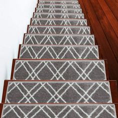 a set of gray and white carpeted stairs