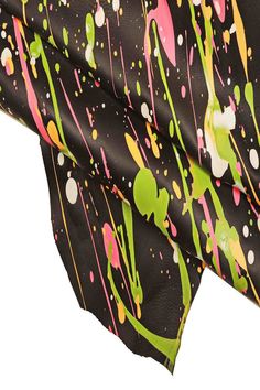 a black scarf with colorful paint splatters on it