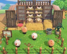 an animal farm with hay and chickens in the yard next to a fenced off area