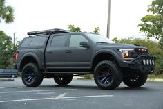 a large gray truck parked in a parking lot