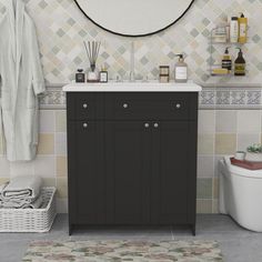 a bathroom with a sink, mirror and toiletries on the wall next to it