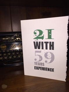 a greeting card with the words, 21 with 59 years experience on it in front of an old typewriter