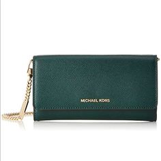 Michael Kors Large Wallet On Chain Racing Green Michael Kors New With Tag! Size: Large Color: Racing Green Crossbody Bag Tri-Fold Design Snap Closure Gold-Tone Exterior Hardware 1 Front Zip Pocket & 1 Front Slip Pocket 1 Interior Slip Pocket 1 Removable Zip Card Inset With 6 Credit Card Slots ( Bag Measurement: 7-3/4"W X 4"H X 1-1/2"D 22-1/2"L Removable Strap If You Have Any Further Questions Feel Free To Message Me! No Returns. Thank You And Have An Amazing Day! Green Crossbody Bag, Have An Amazing Day, Convertible Crossbody Bag, Mk Purse, Tan Bag, Michael Kors Crossbody Bag, Racing Green, Wallet On Chain, Convertible Bags