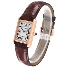 Cartier Tank Louis Rose Gold Mechanical Mens Watch WGTA0011. Manual winding movement. 18k rose gold case 25 mm x 33 mm. Circular grained crown set with a blue sapphire cabochon. . Scratch resistant sapphire crystal. Silvered guilloche dial with black Roman numeral hour markers and an inner minute track. Sword shaped blued hands. Secret Cartier signature at VII. Brown leather strap with 18K rose gold tang buckle. Classic Cartier Rectangular Watches, Cartier Timeless Rectangular Watch Accessories, Timeless Rectangular Cartier Watch Accessories, Formal Cartier Watch Accessories, Rectangular Shape, Cartier Rectangular Watch Accessories For Formal Occasions, Cartier Rectangular Watch Accessories For Formal Events, Formal Rectangular Cartier Watch Accessories, Classic Jewelry And Watches With Polished Rectangular Dial, Timeless Cartier Rectangular Watch