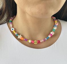 14' Smiley face necklace, Happy Face pearl choker, trendy summer necklaces, colored beaded necklaces Item details: Includes a colorful combination of beads from Czech beads, plastic beads and pearls just like a wheel of fortune you will get an amazing combination of most precious beads  Processing time (the time I need to prepare an order for shipping): 1-2 business days. Estimated shipping times: Actual delivery time will depend on the shipping method you choose at checkout.  The color intensit Smiley Face Necklace, Summer Necklaces, Rave Accessories, Face Necklace, Precious Beads, Mass Communication, Wheel Of Fortune, Summer Necklace, Pearl Choker