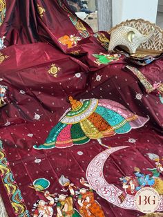 Unleash your inner divinity with our Pattachitra half moon krishna leela hand painted saree. Made from pure bangalore silk in a rich maroon hue, this exquisite piece depicts the divine love story of Krishna and Radha. Elevate your style and embrace the elegance of ancient Indian art with every drape. Pattachitra half moon krishna leela hand painted saree on pure bangalore silk - maroon color Saree comes with a fully stitched blouse. Fall and pico done. Fully stitched blouse shown in pictures is optional and can be purchased seperately from our blouses and croptops section. For saree video please connect with us on whatsapp @469-937-0606 Ready to be shipped in USA from San Diego, California. All pictures are original pictures. Colors may slightly vary due to pic resolution. Festive Meenakari Saree For Rituals, Meenakari Saree For Festivals And Rituals, Festival Rituals Meenakari Saree, Artistic Dupatta For Puja And Navratri, Artistic Dupatta For Navratri Puja, Artistic Traditional Wear For Puja And Navratri, Artistic Traditional Wear For Puja And Festivals, Artistic Traditional Wear For Festivals, Artistic Festive Traditional Wear For Festivals