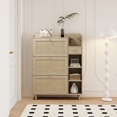 a white room with a black and white checkered rug on the floor next to a cabinet