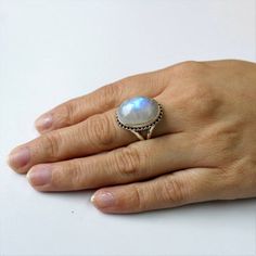 AAA Rainbow Moonstone ring, Real Sterling Silver ring, cocktail ring, alternative engagement ring, avant garde, birthstone ring, Rainbow Moonstone jewelleryDescription:Be assured that the product you order is MADE JUST FOR YOU and is not a mass produced item.The gemstone is a OVAL shaped  AAA RAINBOW MOONSTONEGEMSTONE SIZE- 18*13 mm. You have an option to choose a gem for yourself from a set of the stones. Please ask. The rest of the ring is made from 925 STERLING SILVER i.e 92.5% pure silver. A Bohemian Sterling Silver Moonstone Ring, Bohemian Round Cabochon Moonstone Ring, Bohemian Cabochon Moonstone Ring, Artisan Round Moonstone Ring, Round Moonstone Ring With Natural Stones, Fine Jewelry Moonstone Ring With Natural Stones, Handmade Moonstone Ring With Round Stone For Promise, Unique Moonstone Ring With Stone Setting, Handmade Moonstone Promise Ring With Round Stone