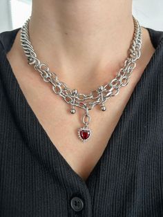 This handmade chunky silver chain necklace is made with silver stainless steel chain and is adjustable with a lobster clasp closure. Each chain is connected in the back, making this layered necklace one piece.  It contains the following -  stainless steel chain red glass rhinestone heart charm piercing connector 14 inches in length, adjustable to 16 inches with a lobster clasp closure **Each necklace comes in a cloth bag, a cleansing cloth, and an anti-tarnish tab to help prolong the life of your jewelry This layered edgy piece will make any outfit look cool and stand out. It fits perfectly with your aesthetic outfits, baddie aesthetic looks, and has an alternative Y2K 2000s design. 'That girl' and 'clean girl,' style and super versatile, this necklace will turn heads, even while paired wi Trendy Heart-shaped Metal Choker, Trendy Heart Shaped Metal Choker, Punk Metal Heart Necklace For Valentine's Day, Trendy Metal Choker With Heart Pendant, Punk Style Metal Heart Necklace For Valentine's Day, Silver Heart Necklace In Grunge Style, Grunge Metal Necklaces For Valentine's Day, Grunge Heart-shaped Metal Necklace, Metal Heart Charm Choker With Heart Pendant