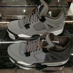 The Appearance Of The Shoes Is Largely Made Of Grey Bulbar Leather. The Buckle On The Side Of The Shoe Is The Same Gray Color As The Shoe Body. The Toe Of The Shoe Is Also Made Of Grey Suede Material, And The Entire Top Of The Tongue And Heel Of The Shoe Up To The Pull Piece Of The Shoe Is Also Made Of Grey. Grey Jordan 4, Jordan 4 Cool Grey, Cool Grey Color, Cute Jordans, Nike Shoes Women Fashion, Birthday Collage, Jordan 4s