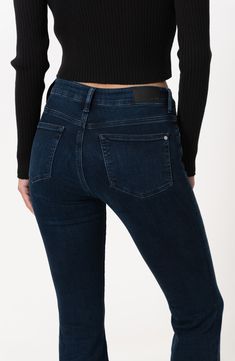 Add a vintage-chic vibe to your casual looks with stretchy, curve-hugging flared jeans featuring trouser-style hems and a polished dark wash. 21 1/2" leg opening; 9 1/2" front rise; 15" back rise Zip fly with button closure Five-pocket style 56% cotton, 15% recycled polyester, 14% recycled cotton, 11% Tencel® modal, 2% polyester, 2% elastane Tencel modal is a more-sustainably produced fiber made with closed-loop processing and is certified with the EU Ecolabel as having a low environmental impac Elegant Dark Wash Bottoms For Fall, Elegant Dark Wash Fall Bottoms, Fitted Mid-rise Elastane Flare Jeans, Elegant Denim Blue Bottoms For Fall, Elegant Mid-rise Jeans For Fall, Elegant Mid-rise Denim Blue Bottoms, Fitted Elastane Jeans For Fall, Elegant Mid-rise Flare Jeans, Elegant Fitted Denim Flare Jeans