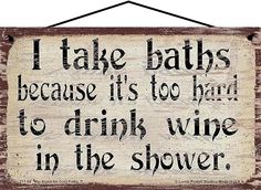 a sign that says i take babs because it's too hard to drink wine in the shower