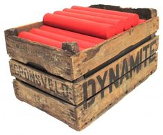 two wooden crates with dynamites in them sitting side by side on top of each other