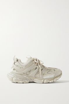 This beige iteration of Balenciaga's 'Track' sneakers will go with practically anything, from sweater dresses to sharp tailoring. Set on signature chunky soles, they're made from rubber and mesh and detailed with the label's logo printed and debossed at the toe. The padded collar and tongue ensure comfort. Balenciaga Track Sneakers, Track Sneakers, Balenciaga Shoes Sneakers, Rubber Sneakers, Balenciaga Women, Balenciaga Track, Sweater Dresses, Balenciaga Shoes, Running Fashion