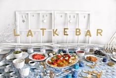 a table topped with lots of food and drinks