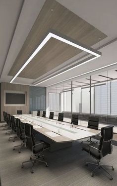 an empty conference room with black leather chairs