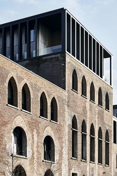 an old brick building with arched windows