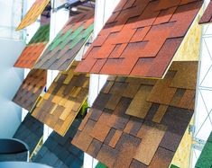 many different colored roof tiles hanging from the ceiling