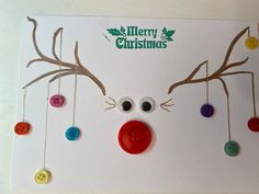 a christmas card with buttons and reindeer's nose