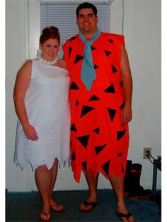 a man and woman dressed up in costumes