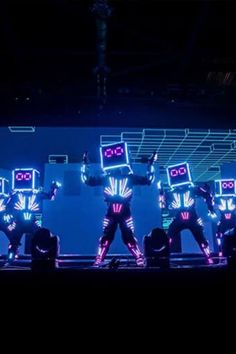 a group of people standing on top of a stage