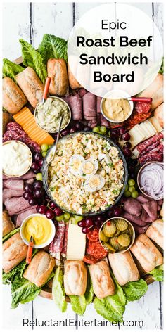 a platter filled with meats, cheese and dips for a roast beef sandwich board