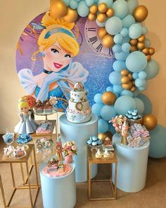 an image of a birthday party with balloons and princess figurines on the table