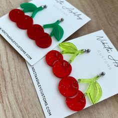 Love cherries? Bias a kpop idol that uses cherries as their symbol? Either way these cherry earrings are a fun way to show your love for the fruit or your bias! They measure about 1.5" at the widest point and have a drop of about 2".  The earrings are finished with stainless steel ball studs but if you require an alternative to make wearing them possible please reach out prior to placing an order. Be sure to check out Nikita Ashley Customs on Facebook, Instagram or our website - www.NikitaAshley Trendy Cherry-colored Earrings, Handmade Trendy Cherry Earrings, Trendy Handmade Cherry Earrings, Trendy Handmade Cherry Colored Earrings, Jewelry Kpop, Laser Cut Jewelry Acrylic, Kpop Bias, Laser Cut Jewelry, Cherry Earrings