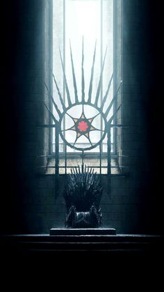 a iron throne sitting in front of a window with a star on it's back