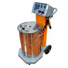 a machine that is sitting on top of a metal barrel with an orange container next to it