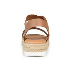 Enjoy the warm weather in the Caroline by Journee Collection. This strappy sandal features elastic uppers for a flexible fit and a 7 mm Tru Comfort Foam� footbed for added support. A walkable sliver wedge heel wrapped in espadrille perfects the design. At Journee Collection our sandal styles are going to be perfect for any occasion. Whether that be a formal business or casual dress these sandals will be a perfect match. Strappy Wedge Sandals For Beach, Synthetic Ankle Strap Sport Sandals For Beach, Spring Synthetic Sport Sandals With Strap, Adjustable Strappy Wedge Sandals For Beach, Spring Synthetic Wedge Heel Sport Sandals, Casual Wedge Heel Sport Sandals For Spring, Brown Synthetic Sport Sandals For Summer, Casual Spring Sport Sandals With Wedge Heel, Closed Toe Wedge Sandals With Arch Support For Vacation