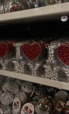 many heart shaped candies on display in a store