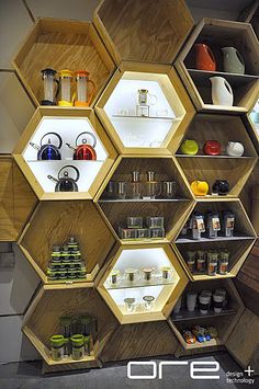 the shelves are made up of hexagons and honeycombs for storage