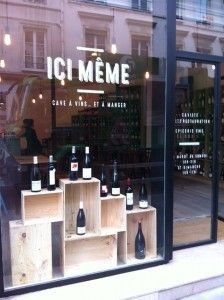 bottles of wine are displayed in the window