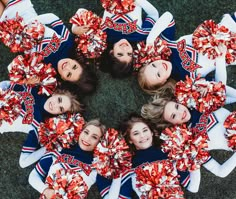 a group of cheerleaders standing in a circle