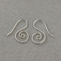 "This unique scroll earrings are handmade using sterling silver. Free US Shopping. Customers who purchased this item said: \"simple and elegant, love these earrings! \" \"LOVE these! They were a little larger than I had expected but have quickly become my favorite pair of earrings! \" The length of the earrings is: 3/4inches, 20mm. ;-) My contact number: 626-379-1904. Please contact me if you would like to order multiples or customize a design for your special event, I will be pleased to give yo Minimalist Sterling Silver Swirl Earrings, Minimalist Swirl Earrings As Gift, Minimalist Silver Swirl Earrings, Minimalist Swirl Earrings Gift, Sterling Silver Swirl Earrings For Gift, Swirl Shaped Sterling Silver Earrings For Gifts, Hypoallergenic Sterling Silver Swirl Earrings, Earrings Bridesmaid, Beaded Material