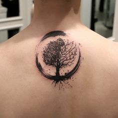 a man with a tree tattoo on his back