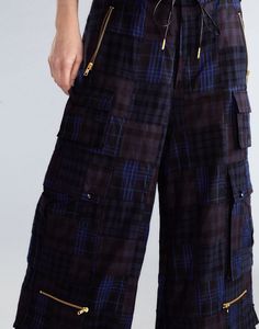 Madrid madras plaid cargo pants. Gold hardware detail pockets Side flap button pockets Side zip pockets D-ring gold metal accents Drawstring waist Navy madras plaid print Elastic drawstring hem with gold hardware Fabric content: 100% cotton Care instructions: dry clean only Fit: model is 5'9" and wears a size S. We suggest sizing down. Size S measurements: Inseam: 41" Complete the look: Ardie Striped Rugby Shirt Distressed Tee Plaid Cargo Pants, Navy Cargo Pants, Madras Plaid, Distressed Tee, Metal Accents, Rugby Shirt, Cynthia Rowley, Plaid Print, Ring Gold