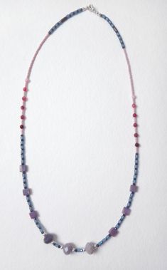 Ombre Beaded Gemstone Necklace in Pinks, Blues & Purple. This piece is made from semiprecious gemstones including; Dyed Imperial Jasper, Pink Agate, Matte Hematite, Purple Czech Glass, Blue African Handblown glass, Sapphire Glass and Pink Seed beads.  It's held together with a brushed silver plated lobster claw clasp.  This necklace is bright and colorful with a playful pattern. Imperial Jasper, Rose Bleu, Pink Agate, Handmade Beaded Jewelry, Lovely Necklace, Glass Bead Necklace, Stylish Jewelry, How To Make Beads, Semi Precious Gemstones