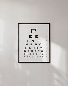 an eye chart is hanging on the wall