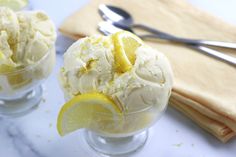 two glasses filled with ice cream and lemon slices