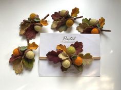 three pieces of felt with leaves and acorns