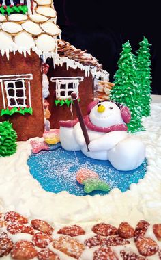 a gingerbread house decorated with icing and decorations