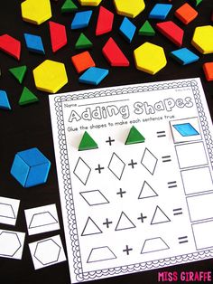 the addition shapes worksheet is next to some colored cubes and other items